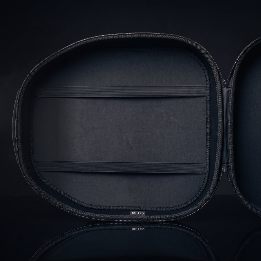 Voyager Hat Travel Case open, showing the Carbon Black interior lining