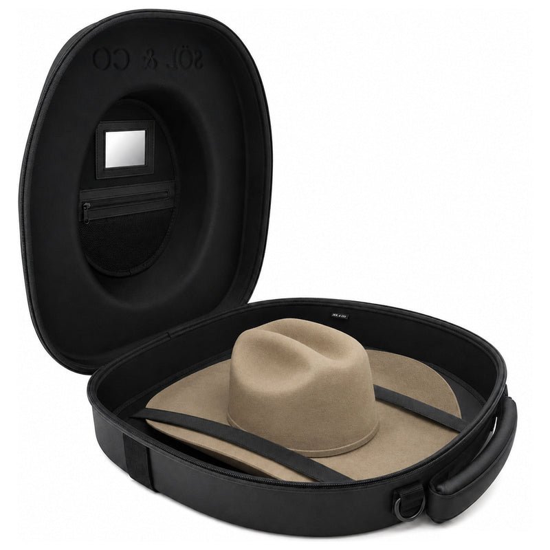 Voyager hat travel case open at three-quarter angle, showing the interior mirror, zip pouch and a felt hat held under crossed straps