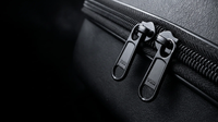 Twin YKK zipper pulls on the Voyager Hat Travel Case's vegan leather shell